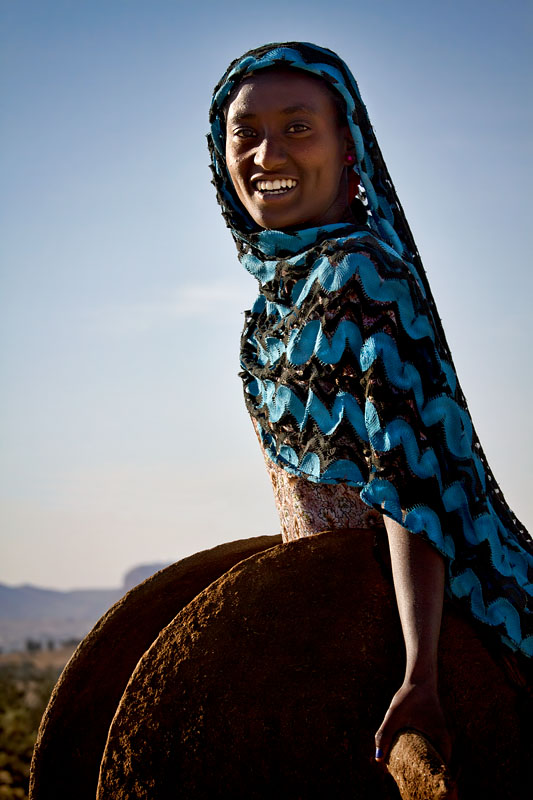 243   On the way to the market with her injera plate covers   Ethiopia